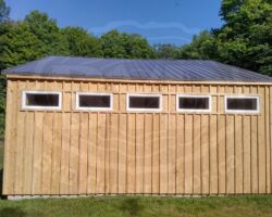High windows to allow natural light into shed, while not blocking the wall for storage.